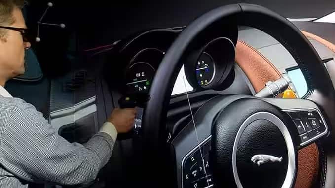 Close up of black jaguar steering wheel.