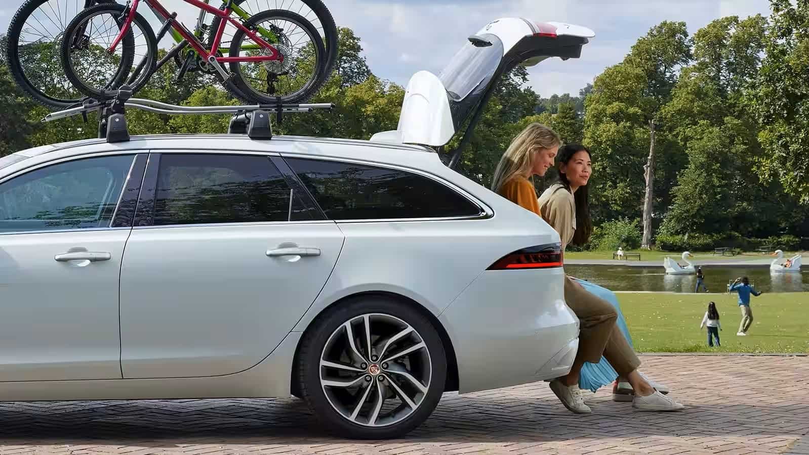 Ladies sitting in a parked car.