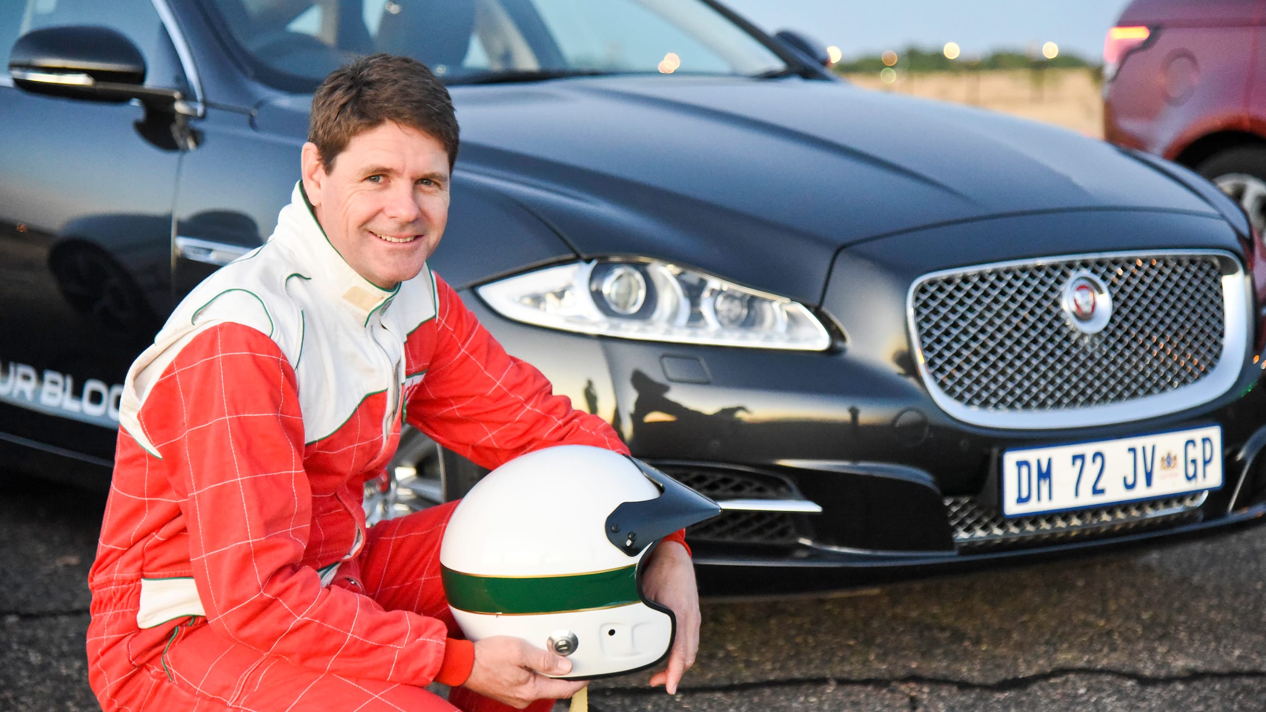 Jaguar XF parked on racing track 